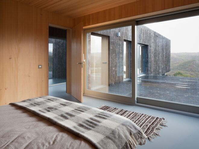 bedroom with large glass walls