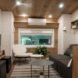 tiny house interior with dark sofa and white chair