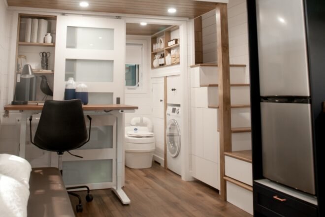 interior area of tiny home with steps leading to sleeping loft
