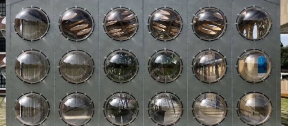 gray building with bubble-like windows