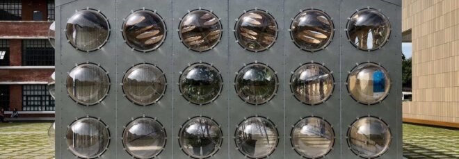 gray building with bubble-like windows