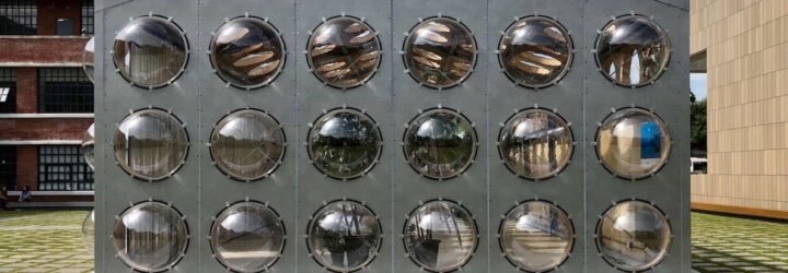 gray building with bubble-like windows