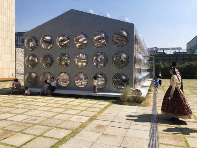 gray gabled building with bubble-like windows