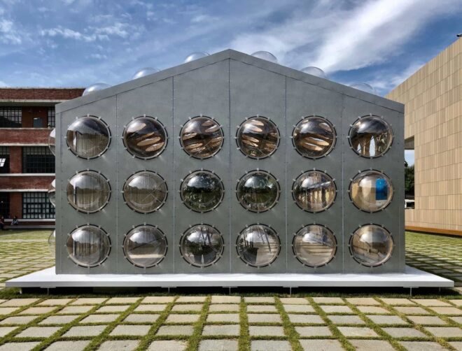 gray gabled building with bubble-like windows