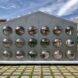 gray gabled building with bubble-like windows
