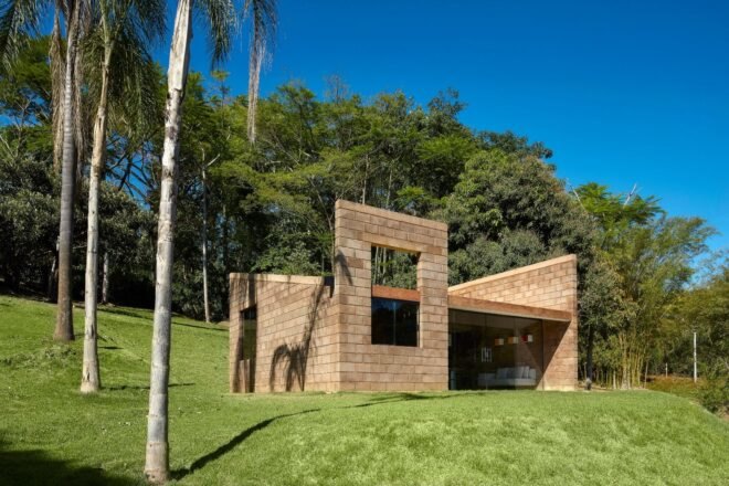 small brick home with slanted roof