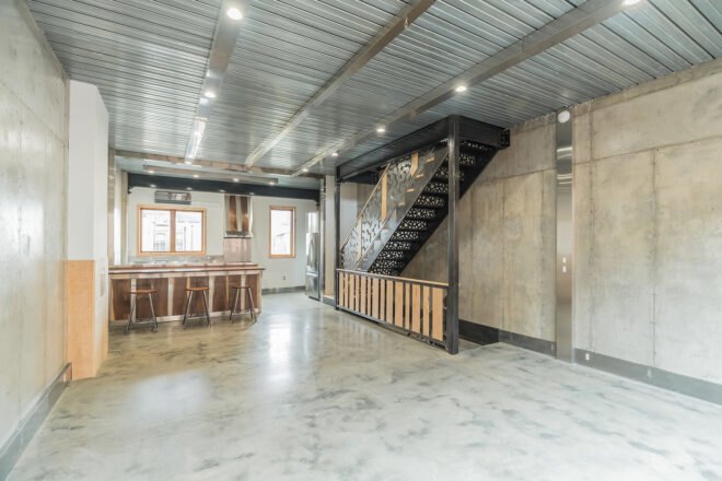 wood kitchen in large gray room