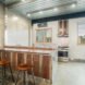wood kitchen with barstools