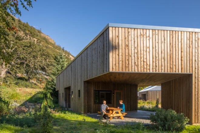 picnic table outside a wood cabin