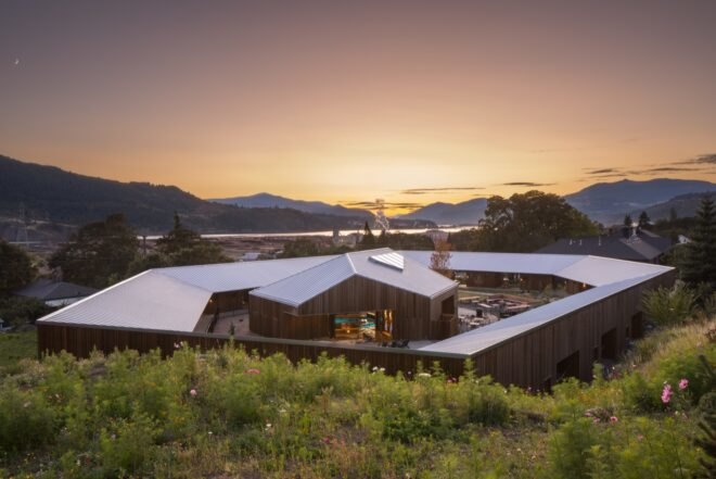 ring of cabins surrounding a wood spa building
