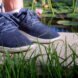 feet wearing blue sneakers