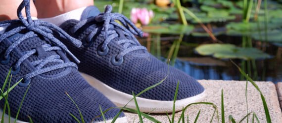 feet wearing blue sneakers