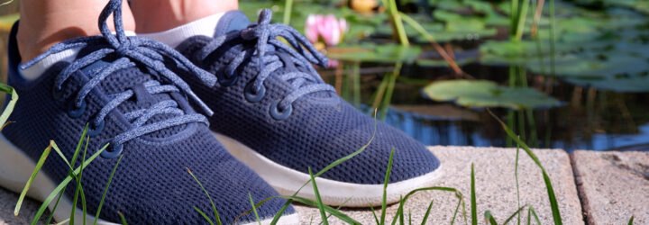 feet wearing blue sneakers