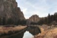 river flowing near large rock formations
