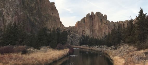 river flowing near large rock formations
