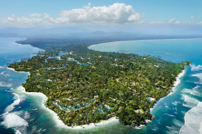 aerial rendering of resort lodgings on lush island