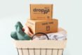 boxes of Dropps on top of pile of laundry