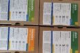 four cardboard boxes of natural cleaning supplies