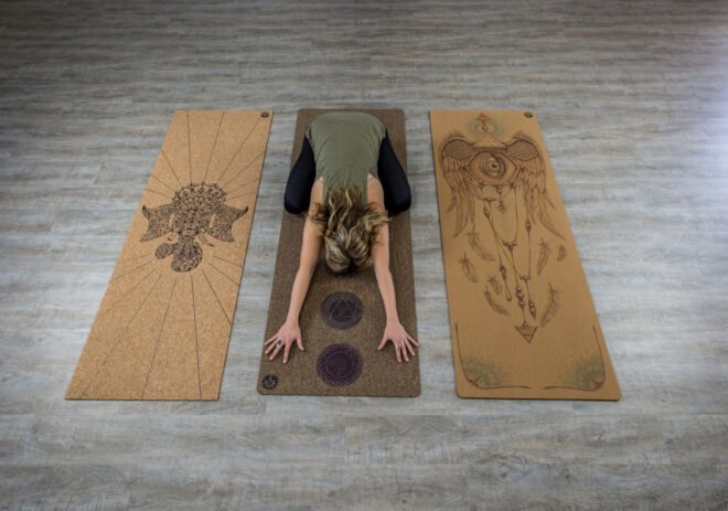 person doing yoga on a cork mat