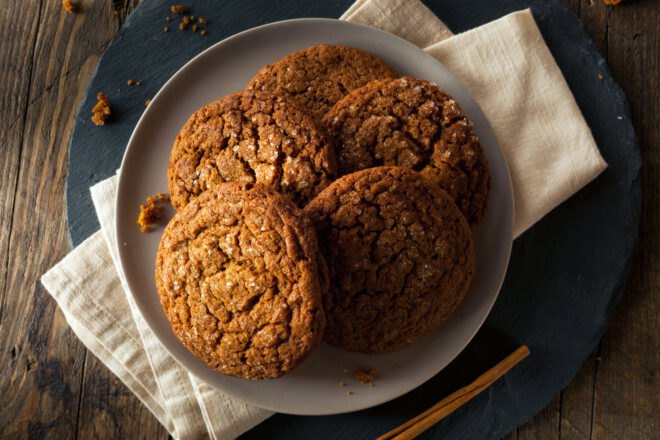 pile of molasses cookies on a plate
