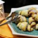 rugelach on a plate near a lantern