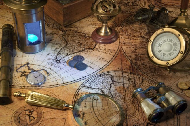 Zodiac globe, vintage map, ship lantern and compass