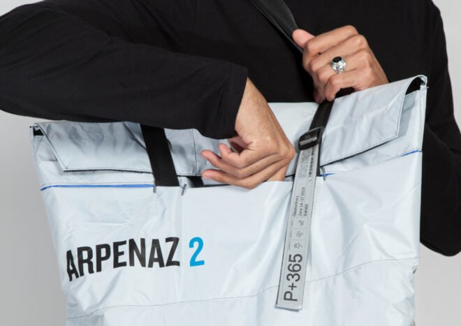 person opening white tote bag