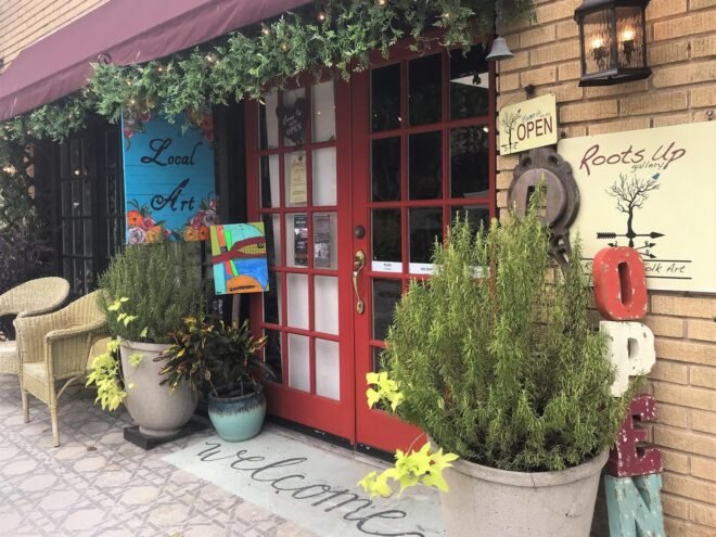 small local art shop with red doors