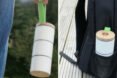 On the left, person holding stacked white food containers. On the right, stacked white food containers in water bottle pouch of a backpack.