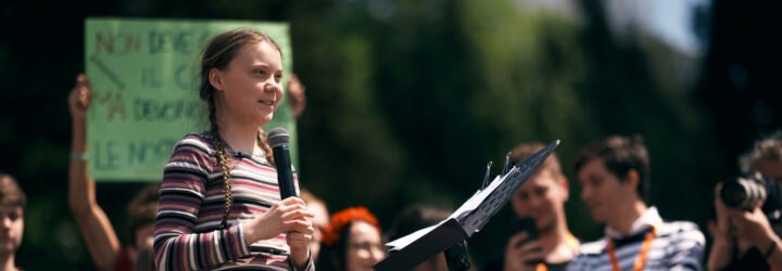 Swedish climate activist Greta Thunberg attending Fridays For Future (School Strike for Climate) protest in front of a huge crowd near the Colosseum