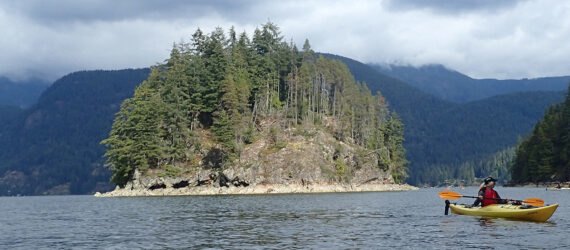 person kayaking in Capilano River