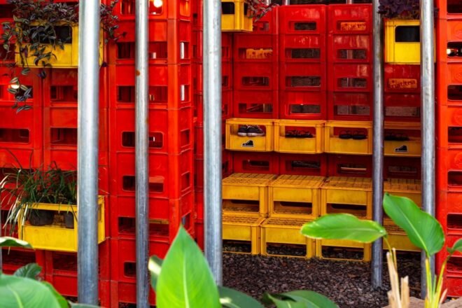 stacks of red and yellow plastic crates