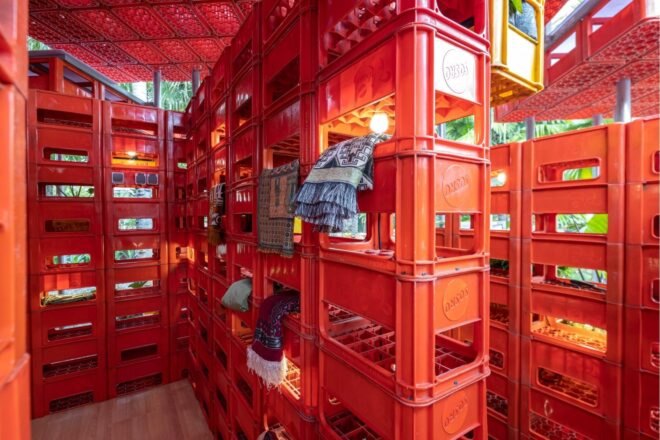 prayer mats hanging from plastic crates