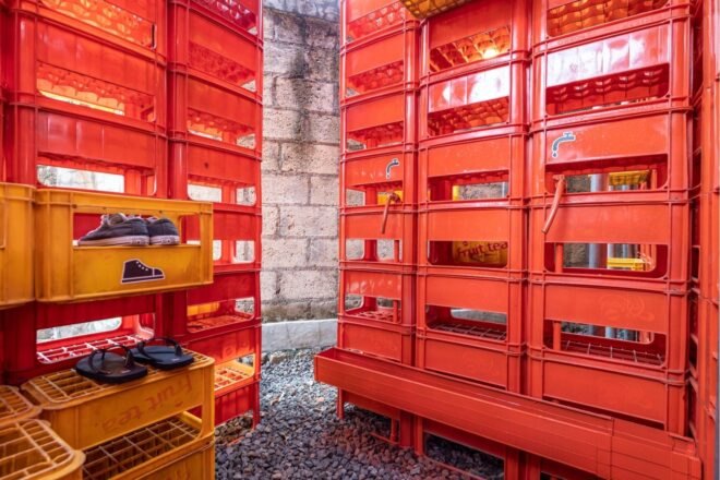 walls made from red and yellow plastic crates