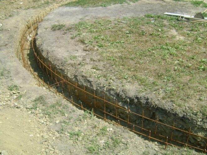large circle dug into grass field