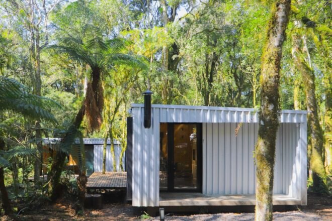 white cubed cabin clad in metal