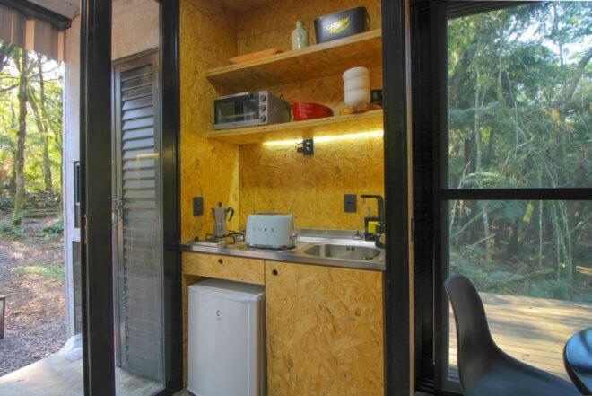 small kitchenette with refrigerator and sink