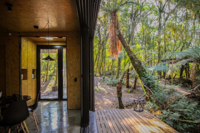 side shot of interior of cabin and outdoor deck