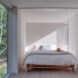 white bedroom with a glass wall
