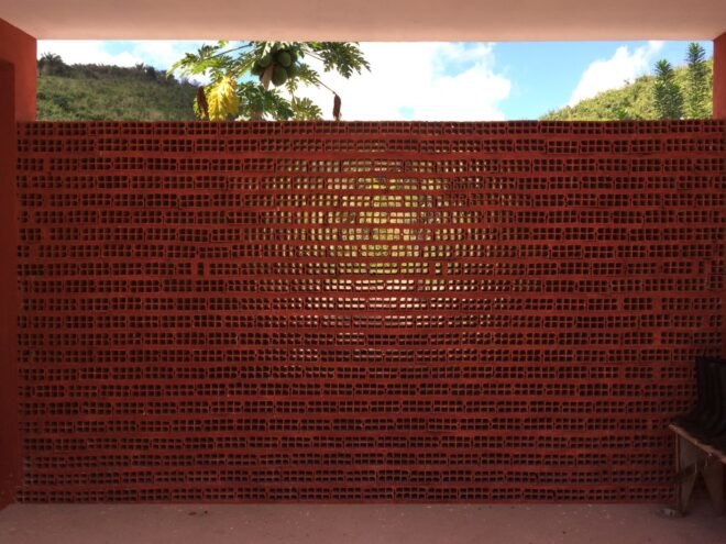 a red, dotted fence-like wall