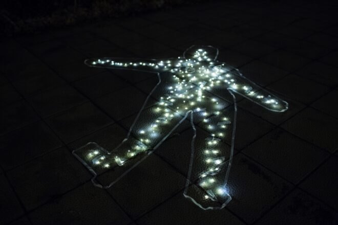 glowing lights on a sidewalk