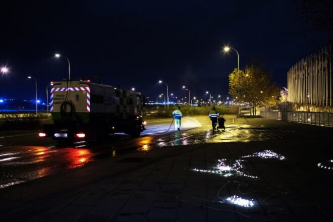 series of glowing lights within chalk outlines in a city at night