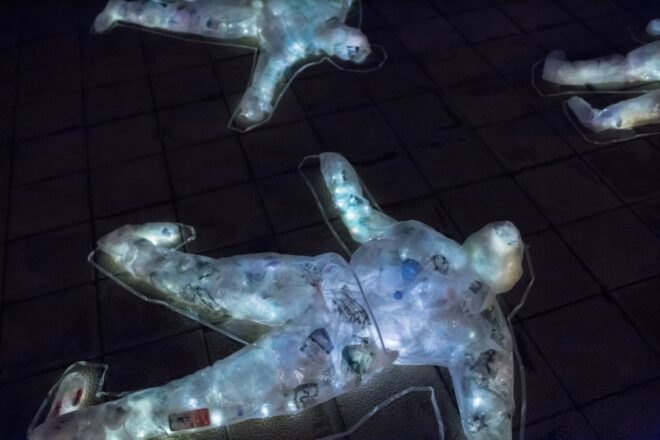 glowing, body-shaped sculptures filled with plastic