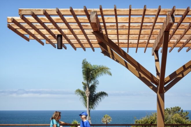wood pergola with ocean in the distance
