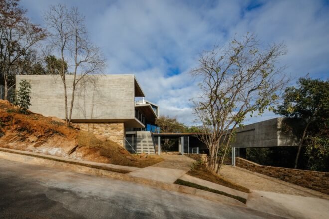 large block home on a sloped hill