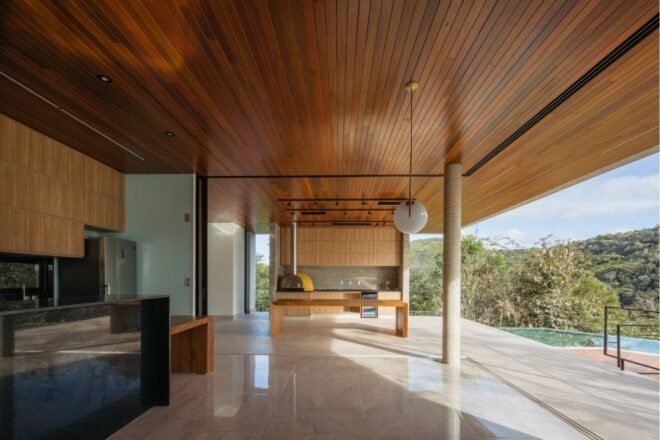 interior living room with open wall leading out to patio