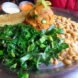 a plate of food featuring greens, beans and sweet potatoes