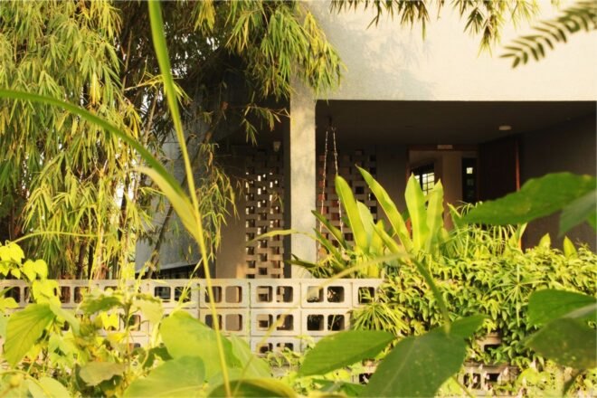 concrete home tucked into greenery