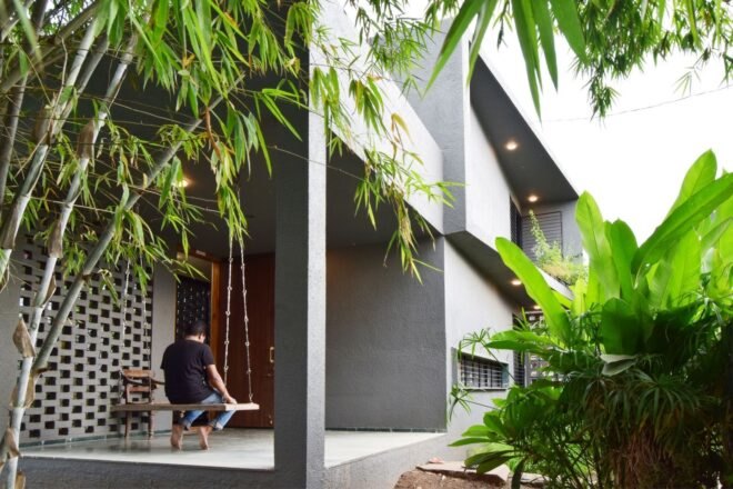 concrete home tucked into greenery