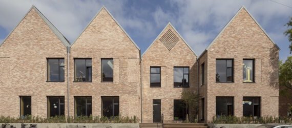 brick school building with multiple gables